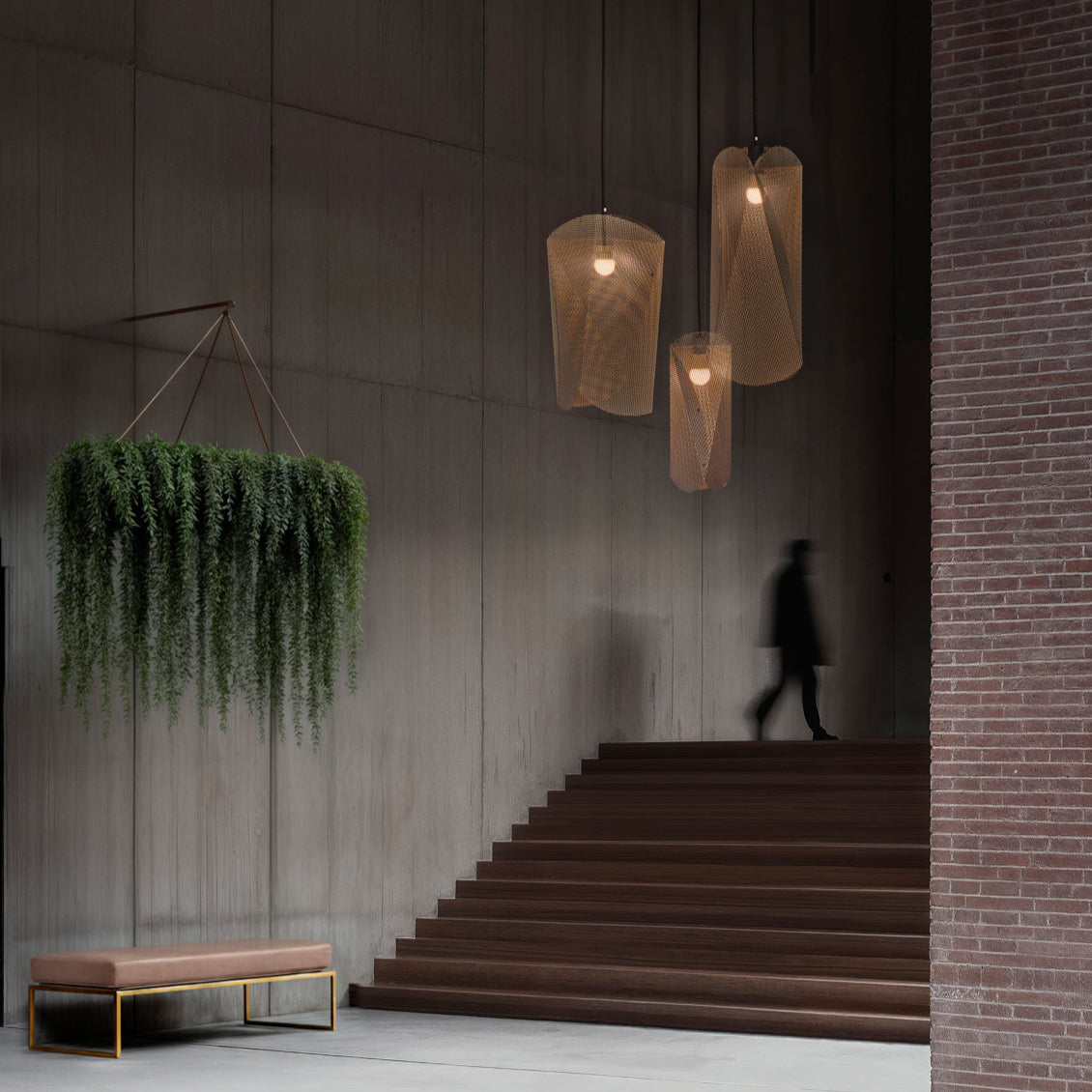 Modern interior with hanging plants, pendant lights, and a staircase.