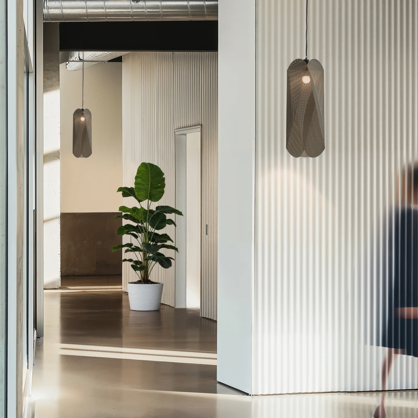 Modern interior with pendant lights and a plant